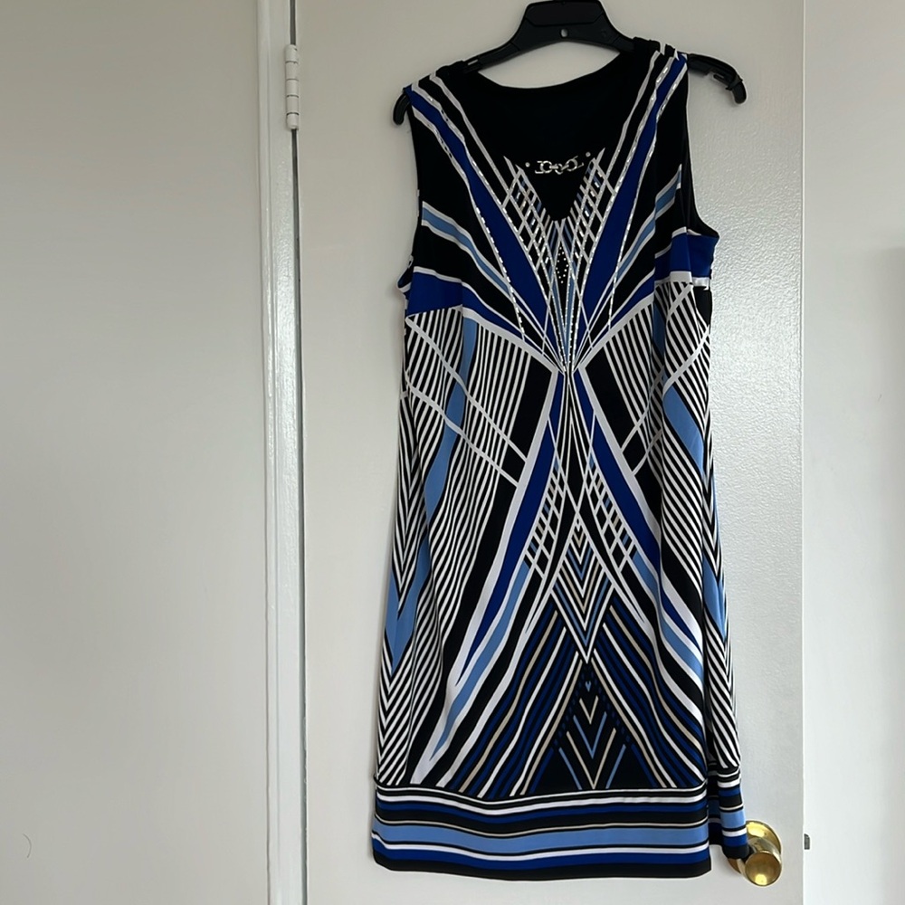 Knee long sleeveless shift dress decorated with silver chain silver studs